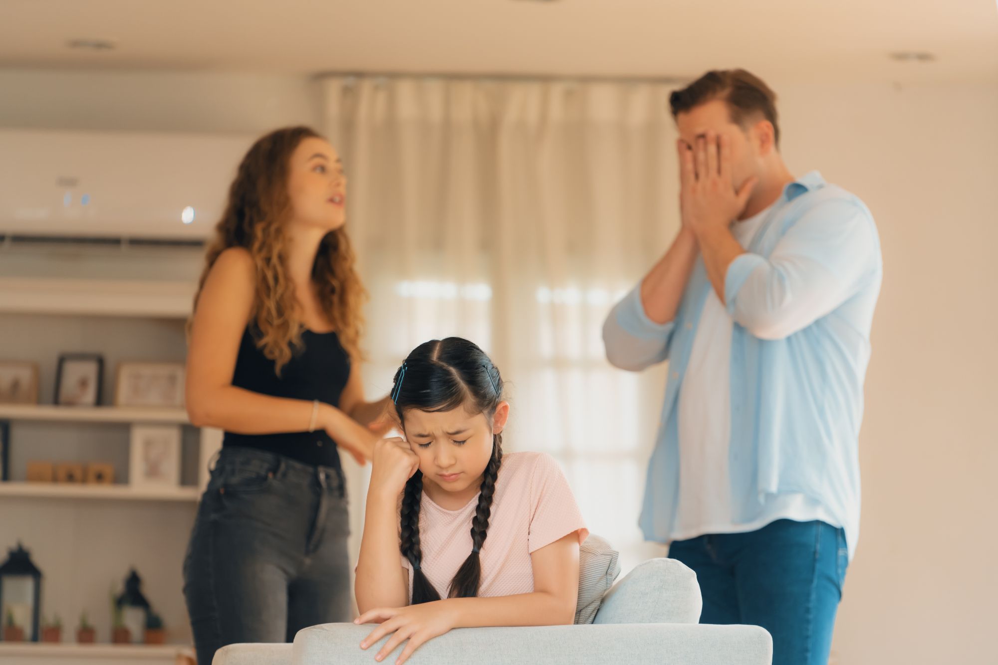 Girl Inbetween Parents Fighting.jpg